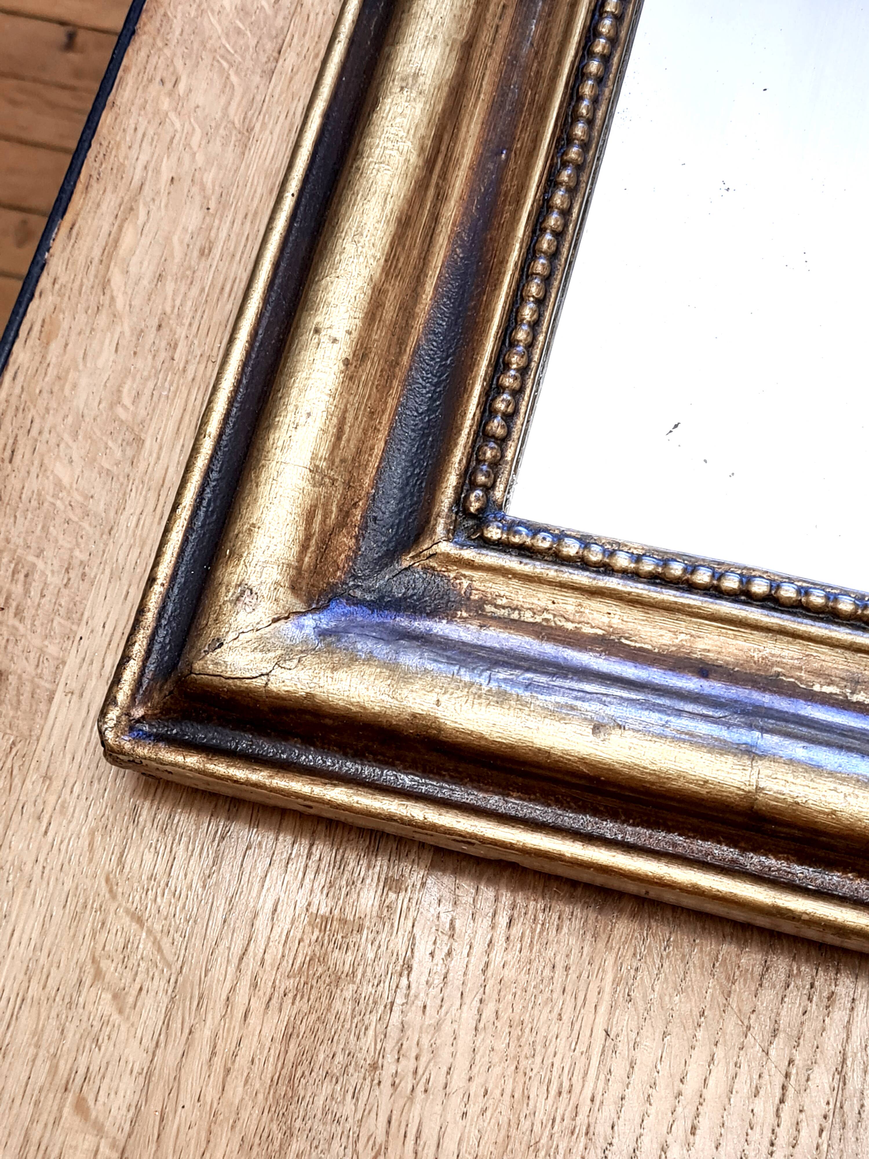 Antique Louis-Philippe gilded mirror “Apoline”