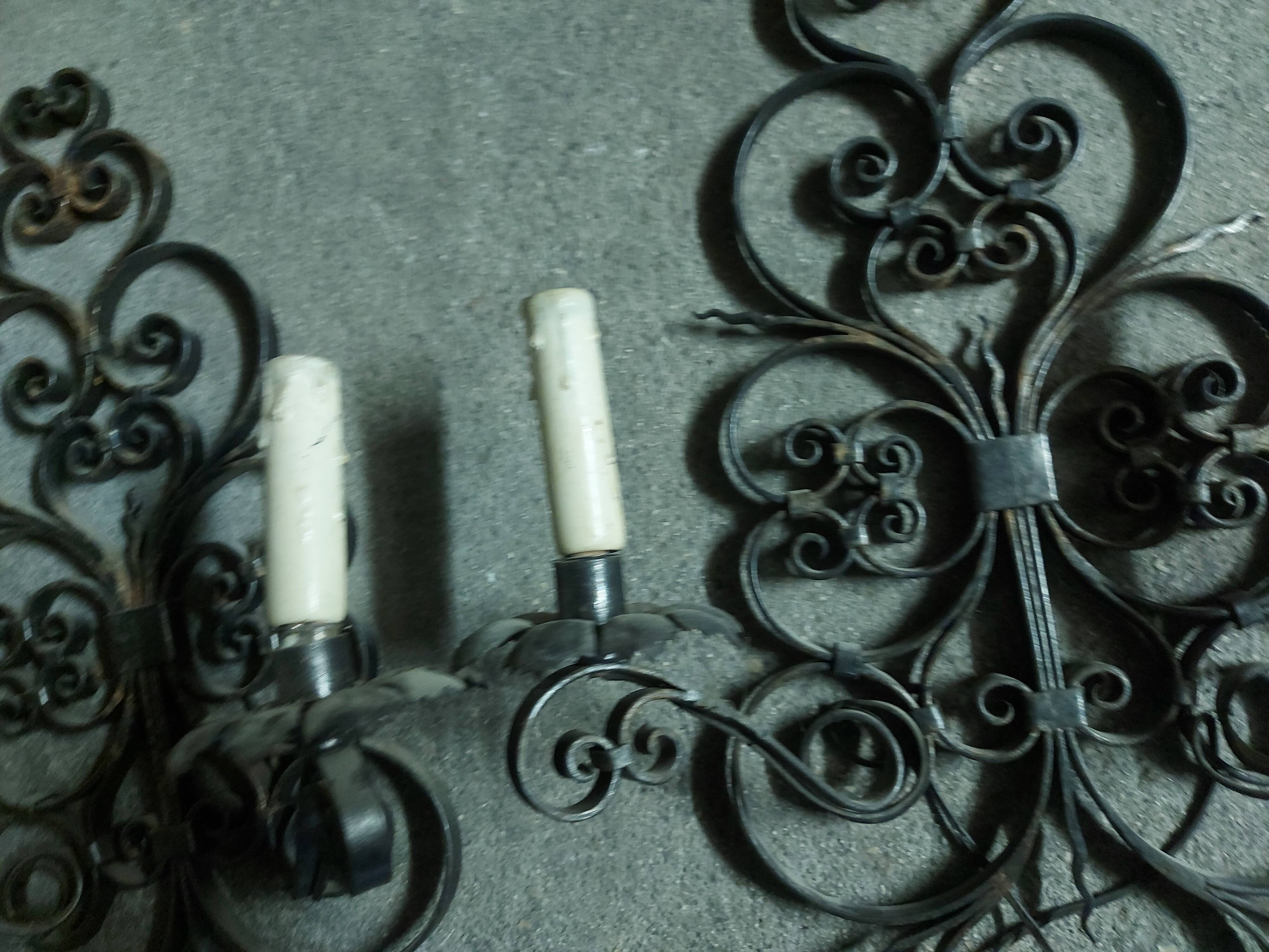 Two large wrought iron wall lights