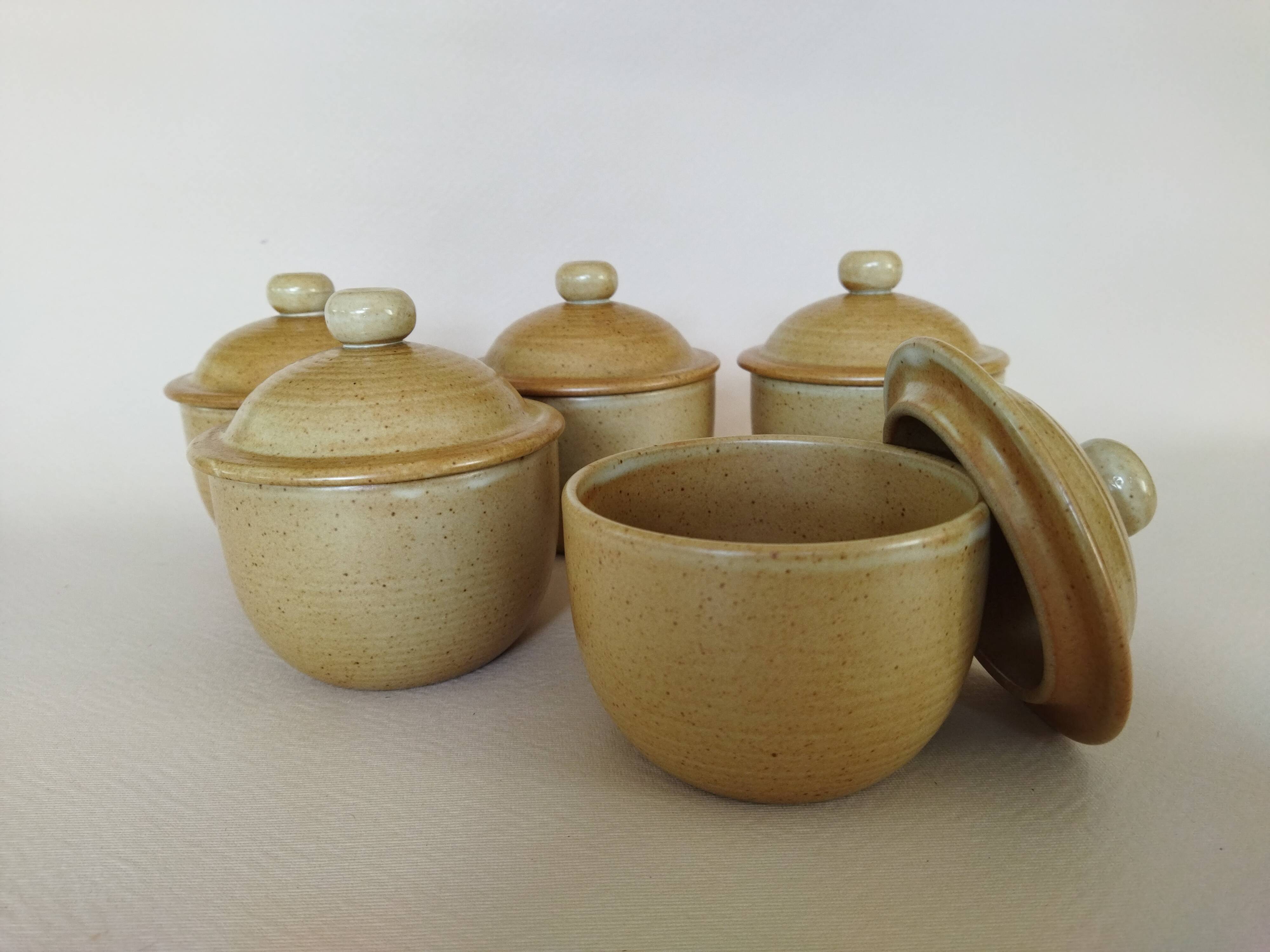 Covered tea bowls in CNP Village sandstone
