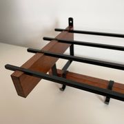 Vintage Scandinavian wall coat rack in wood and metal.