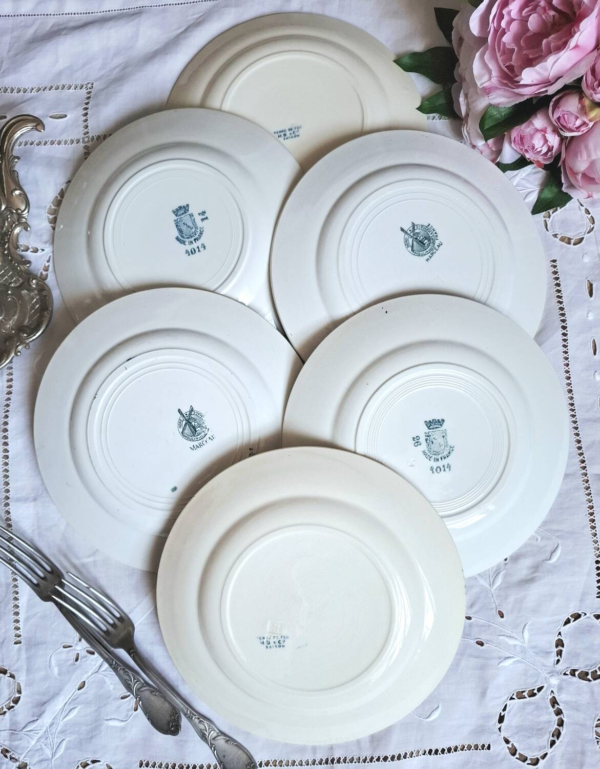 Mismatched antique flat plates made of ironstone accompanied by