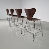 Set of 4 brown oak plywood bar stools by Fritz Hansen Series 7 by Arne Jacobsen.