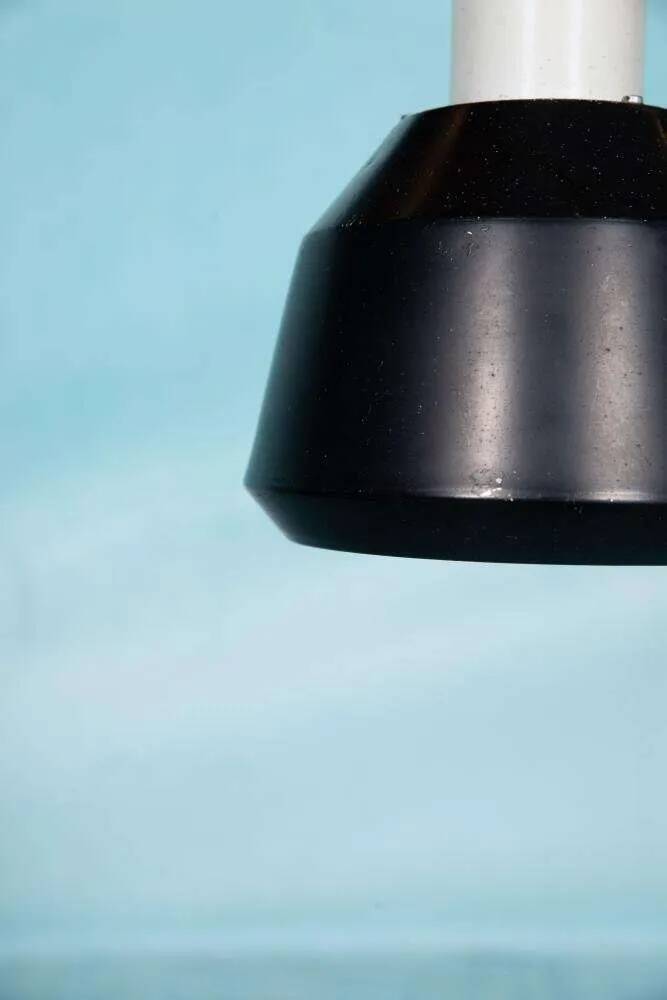 Vintage pendant light design, retro black and white ambient lamp.