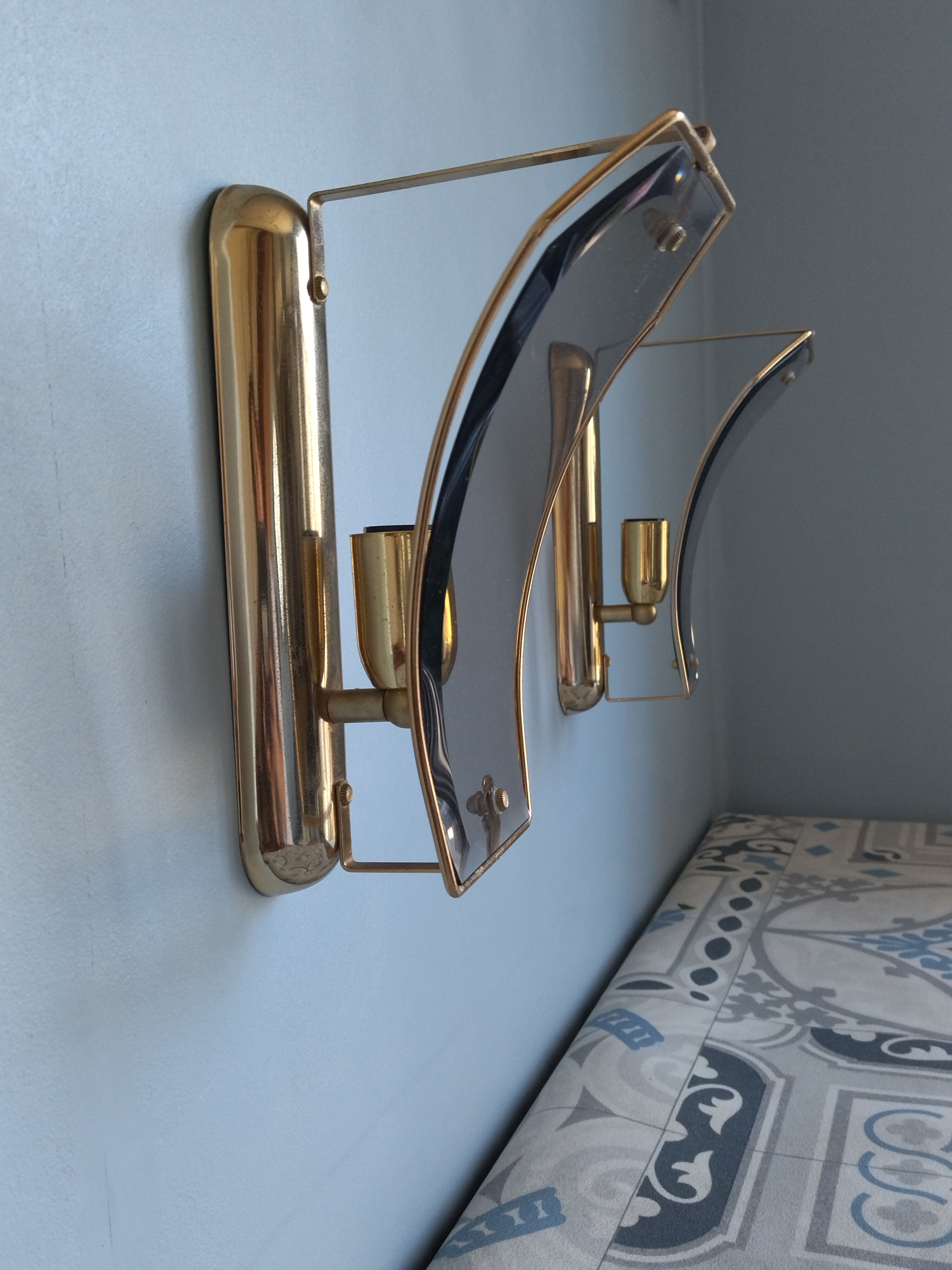 Pair of brass and curved glass wall lamps from the 80s