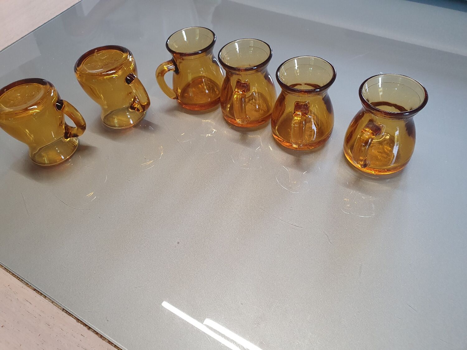 Set of original vintage small amber glass glasses.