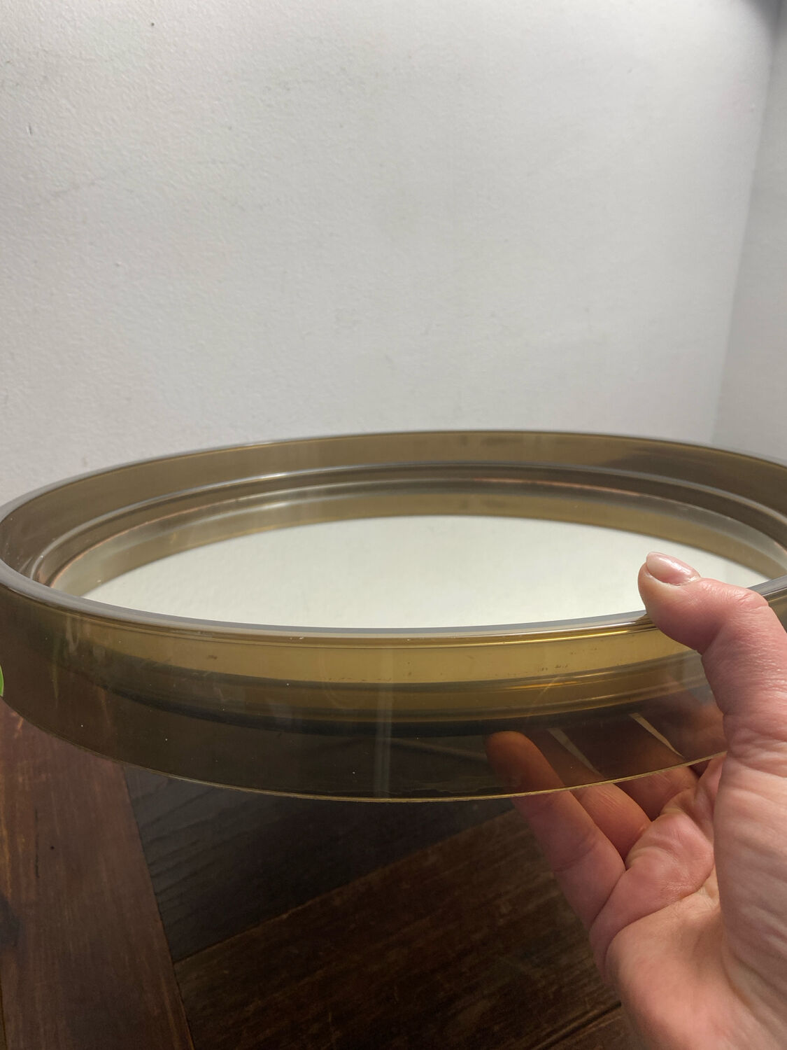 Circular mirror, smoked plastic, 1960s/70s.