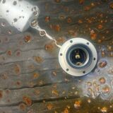 A vintage 70s blown glass pendant light with gold glitter in a globe shape