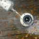 A vintage 70s blown glass pendant light with gold glitter in a globe shape