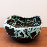 Empty pocket in black ceramic with green drip
