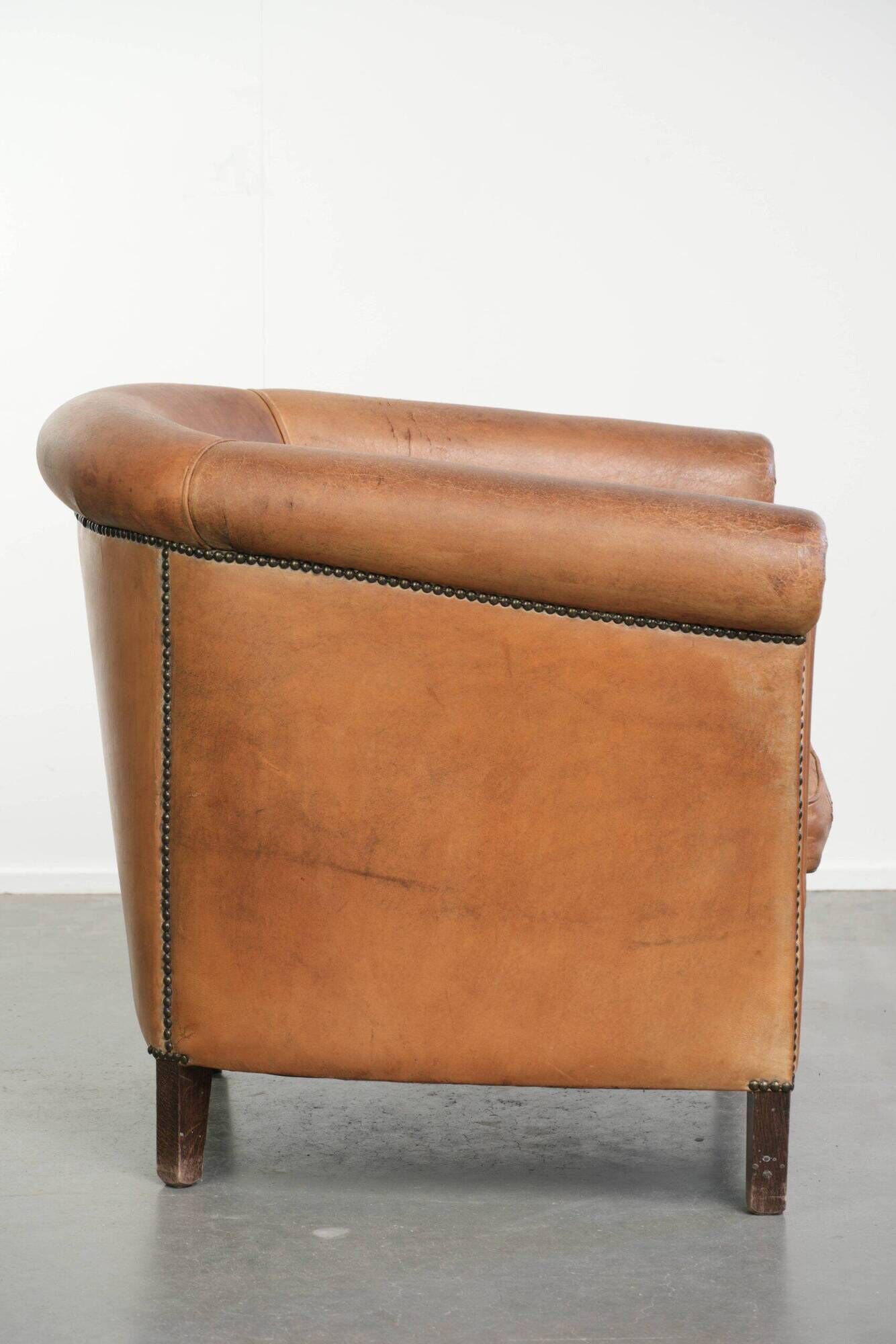 Vintage sheepskin club armchair in a beautiful light cognac colour