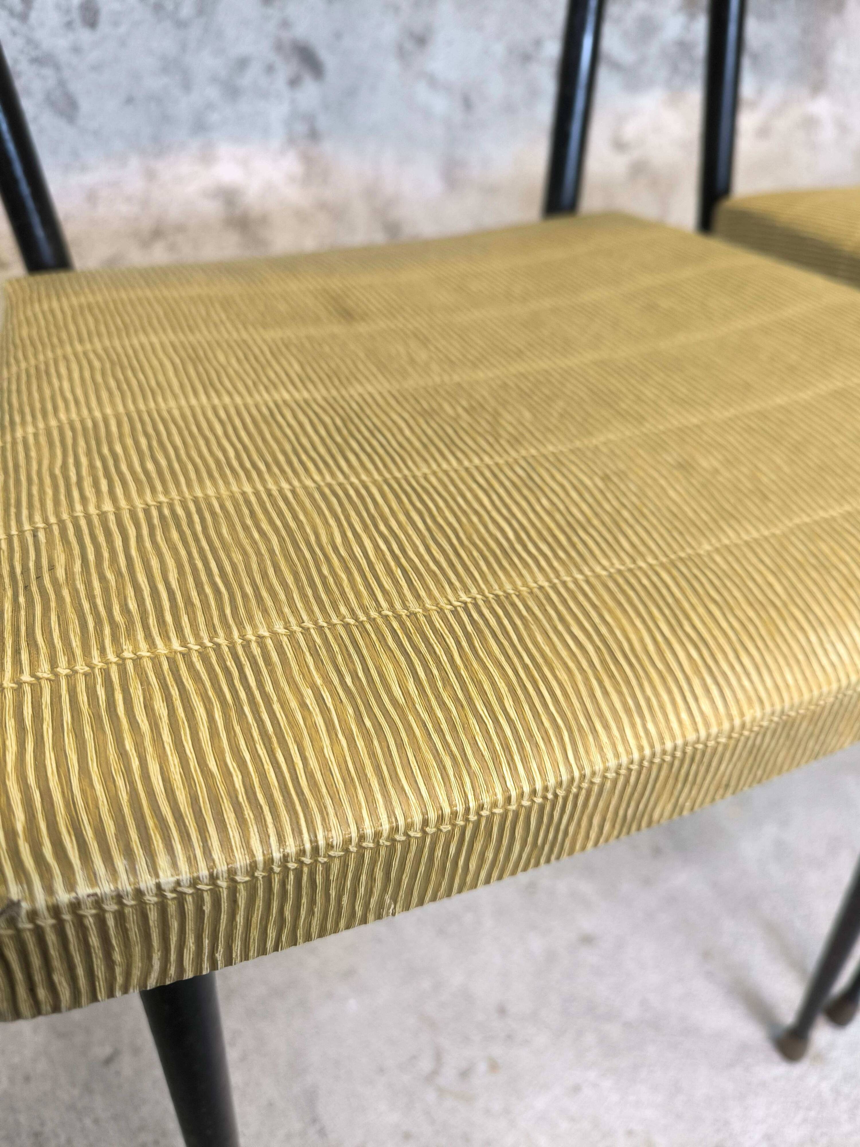 Three vintage chairs in the style of Colette Gueden.