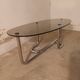 Table basse en verre fumé et métal chromé