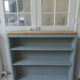 Vintage shallow bookcase, re-enchanted in gray green, wooden tray.