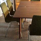 Extendable teak and teak veneer dining table