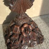 Antique wooden crucifix carved from the Black Forest with grapes and leaves.