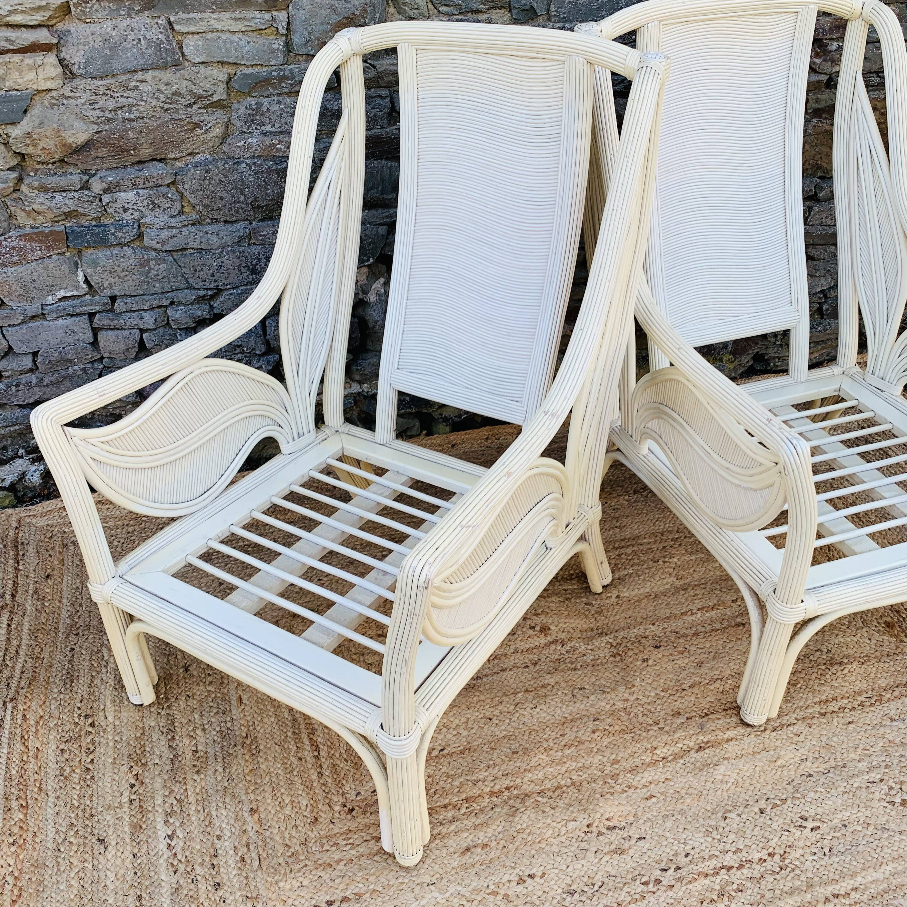 Pair of white rattan armchairs