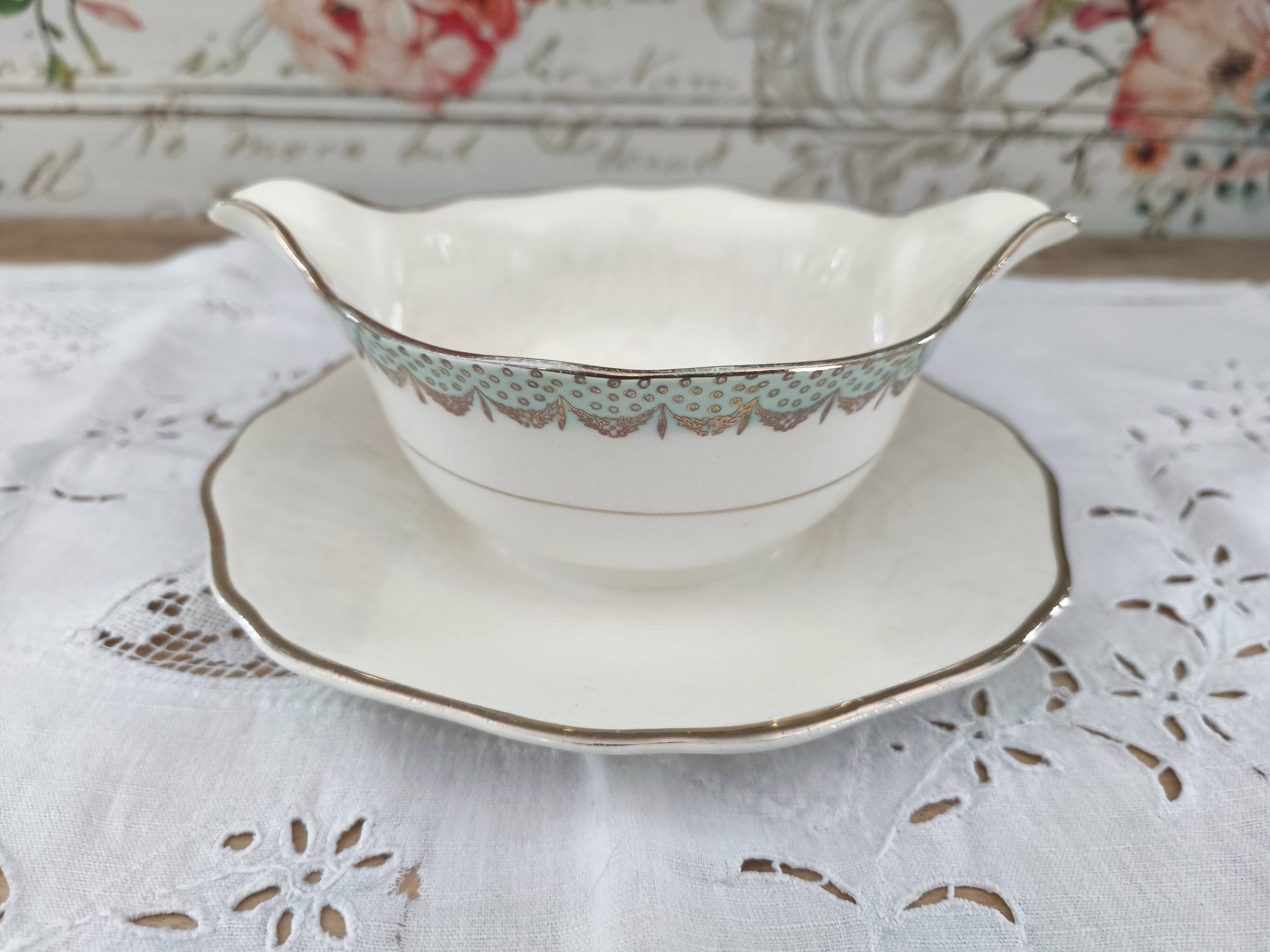 Round sauceboat on Longwy France earthenware frame, Trianon model