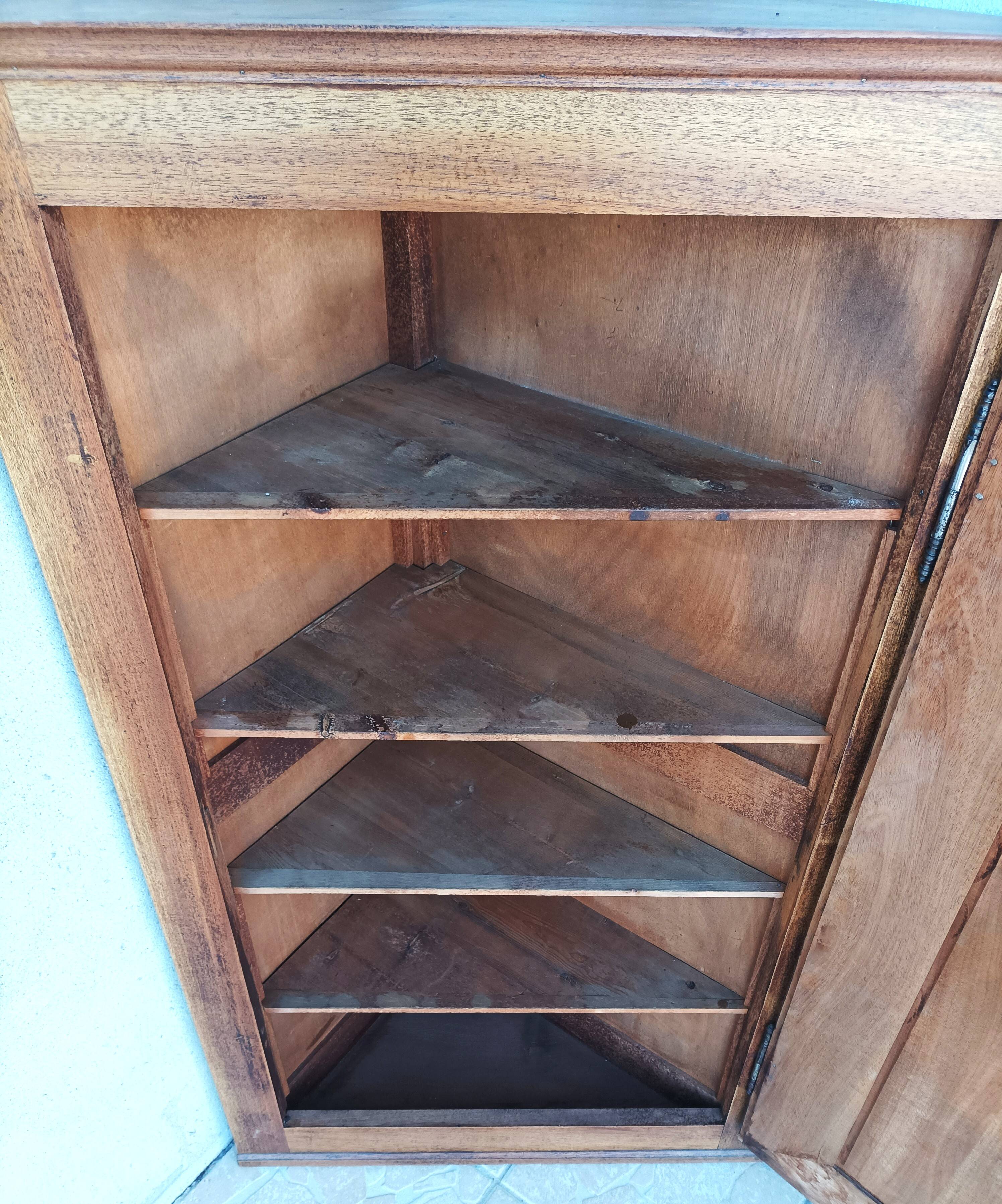 Corner cabinet in carved walnut, Savoyard style.