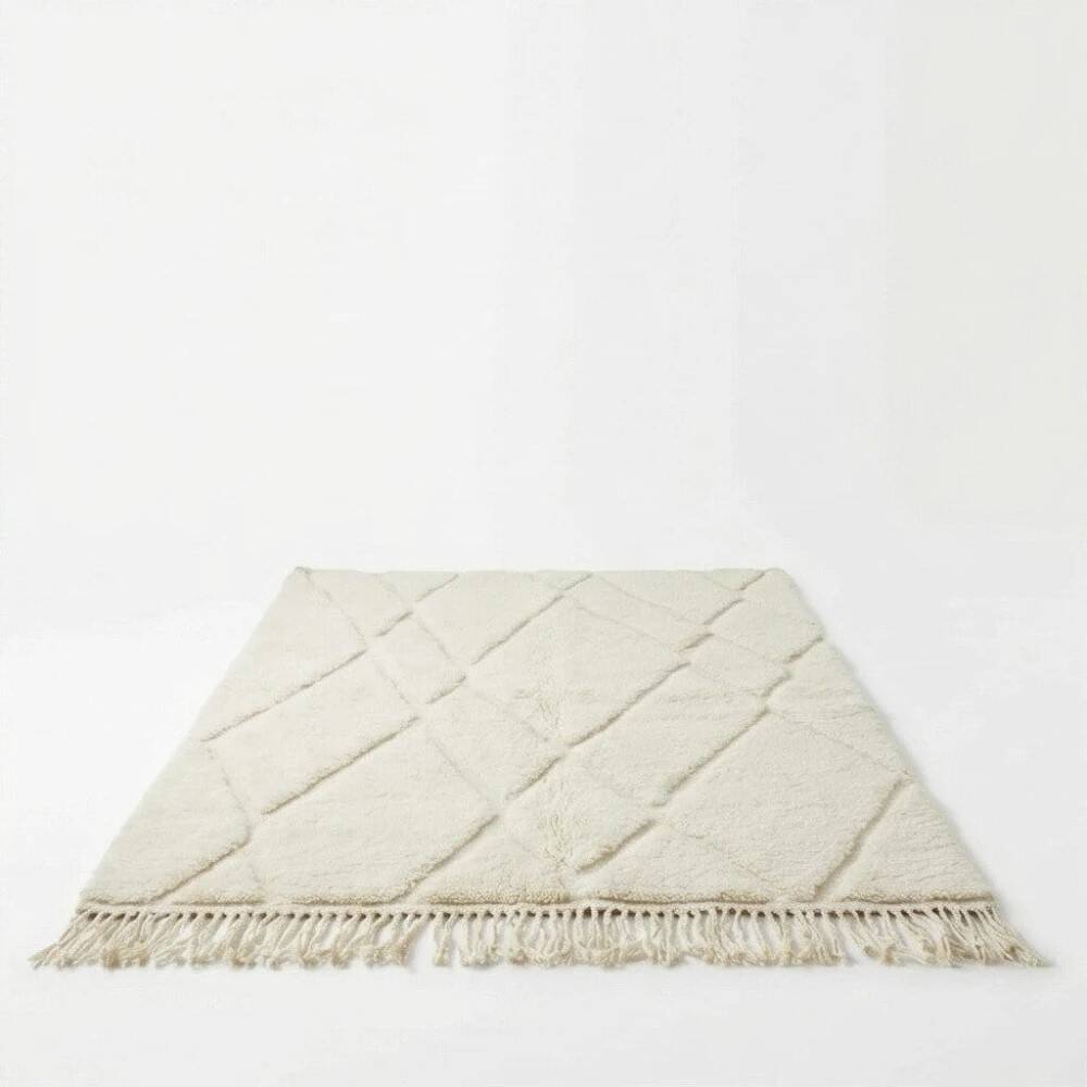 Berber wool rug with abstract white patterns