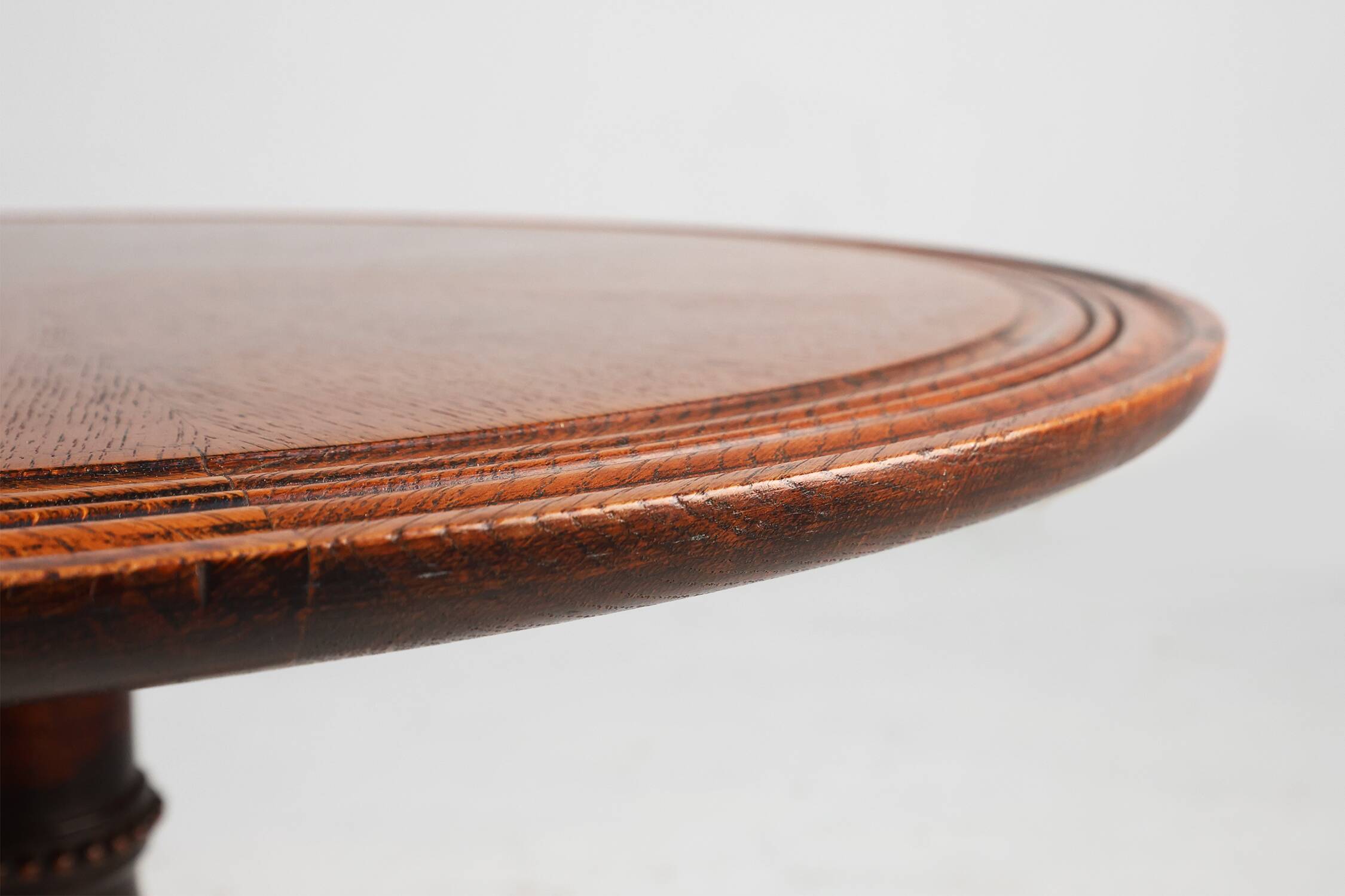 Antique English hand carved circular oak side table with lions head feet