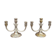 A pair of candlesticks. silver metal with gold decoration.