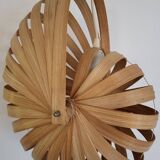 Nautilus shell-shaped chandelier made from bamboo slats
