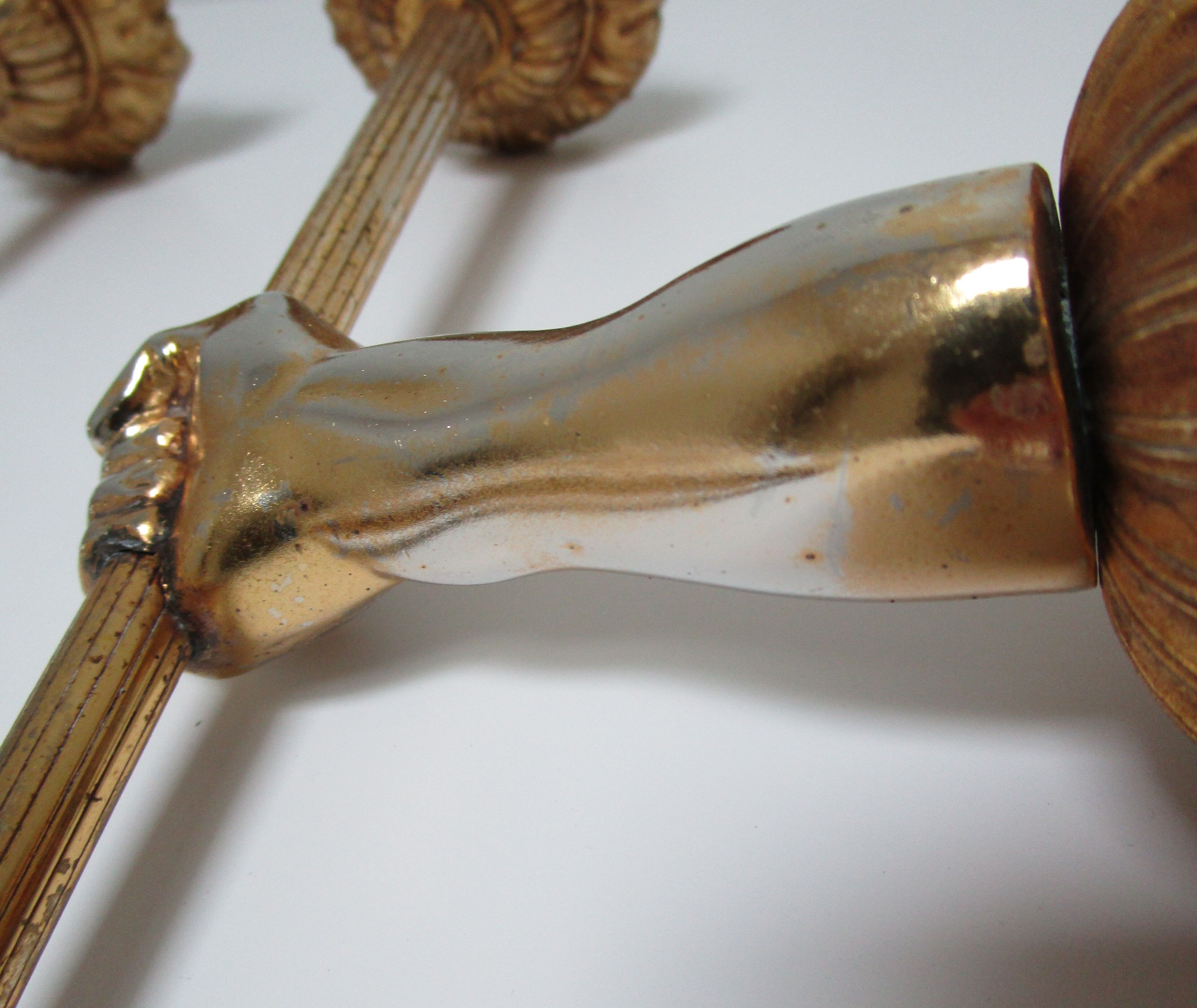 Pair of vintage patinated golden metal hand sconces