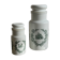 A pair of white glass bottles with Italian green patterns.