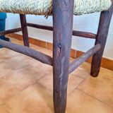 Moroccan bench in dark wood with woven palm leaf seat