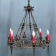 Wrought chandelier in Gothic style.