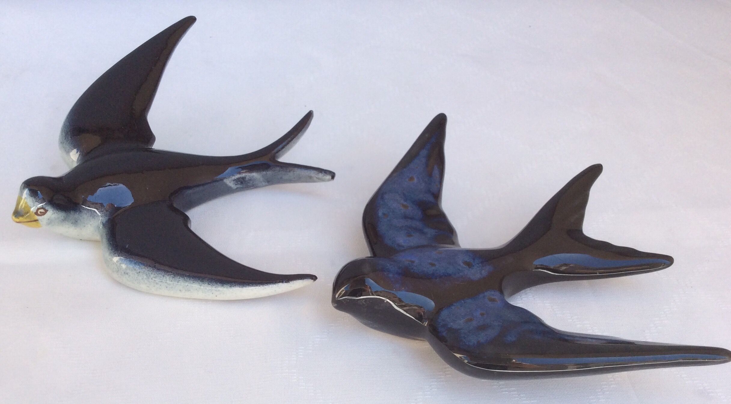 Two ceramic wall swallows