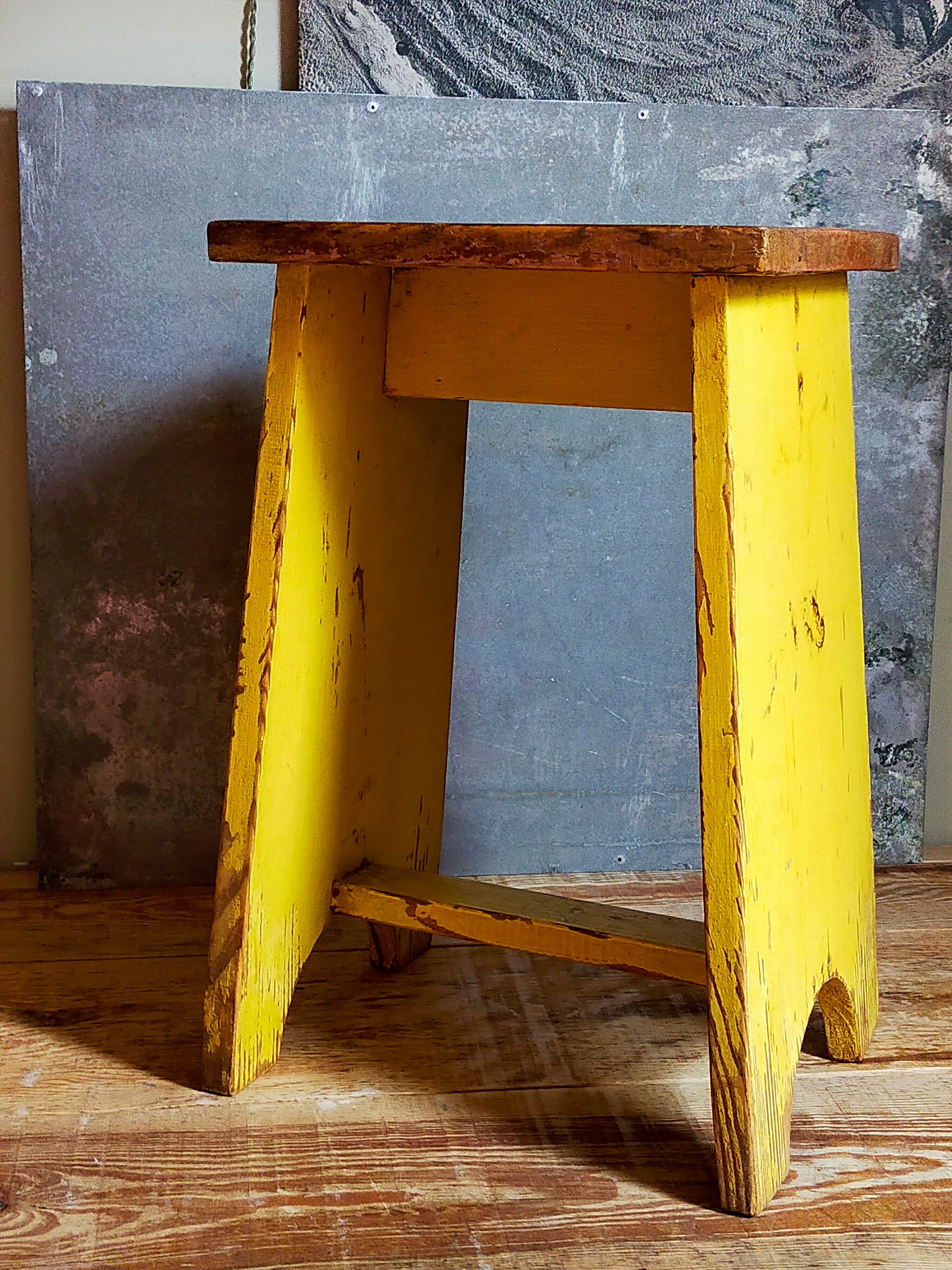 Art-populaire workshop stool in patinated wood