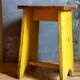Art-populaire workshop stool in patinated wood