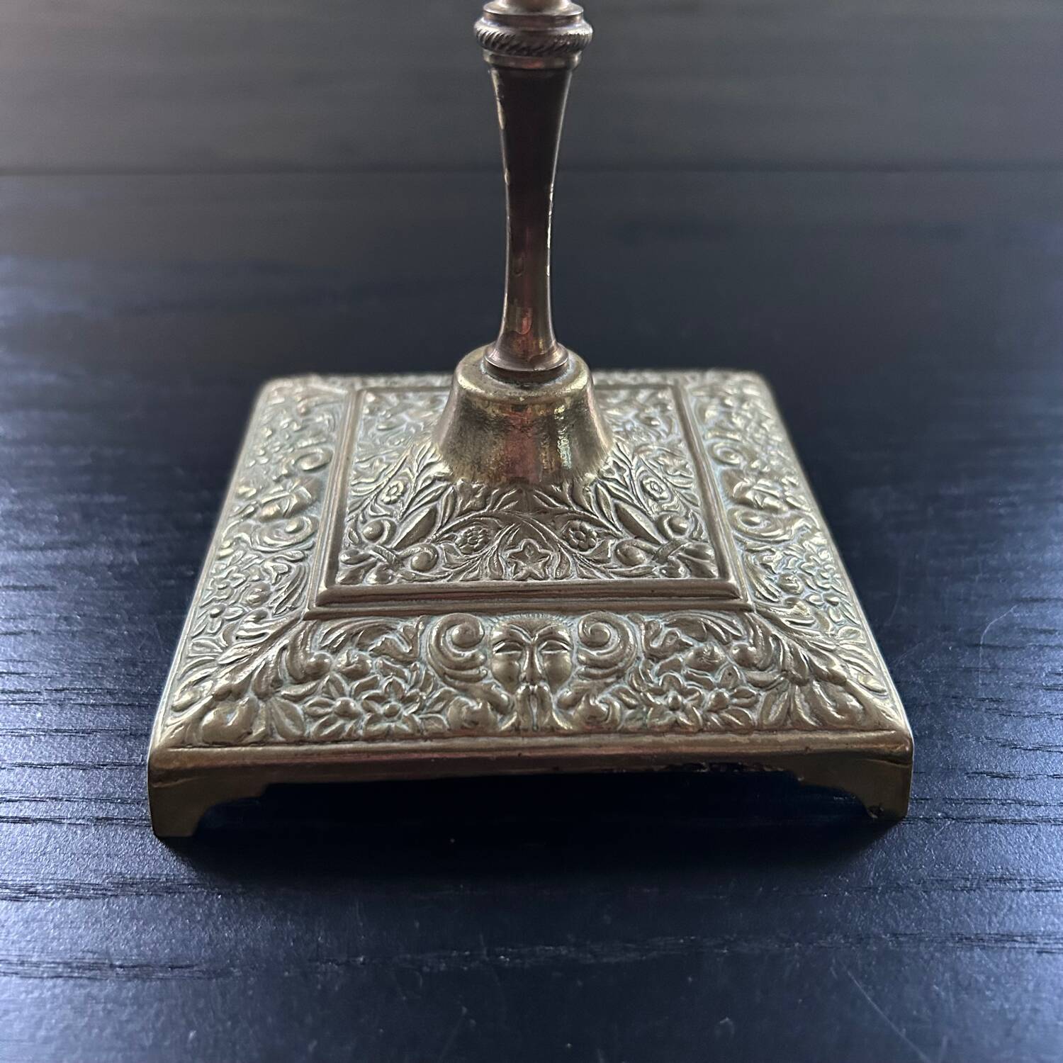 Chiseled brass candle holder