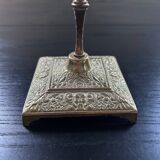 Chiseled brass candle holder