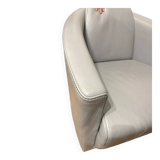 Two-seater sofa and a grey leather armchair Italia.