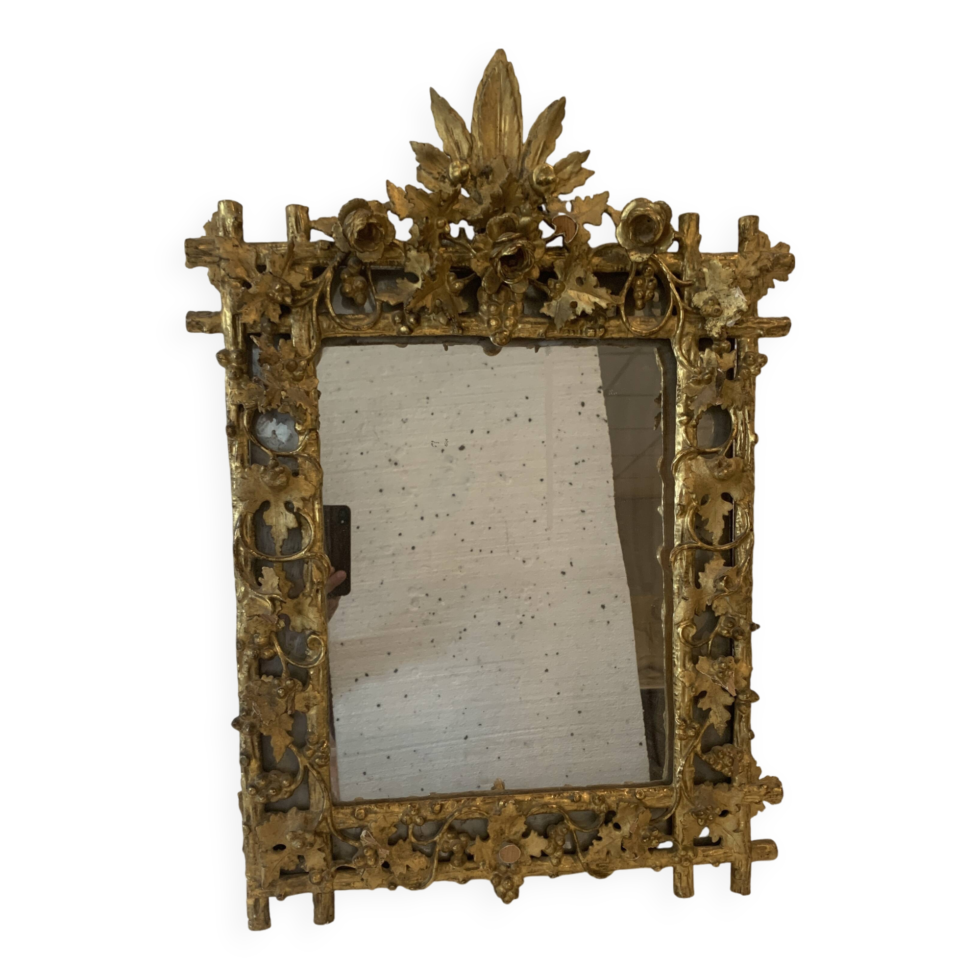 Louis XVI style mirror in carved wood and gilded with gold leaf, 19th century