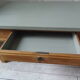 Table basse vintage, piétement, ceinture, tiroir et tablette bois, plateau vert de gris.