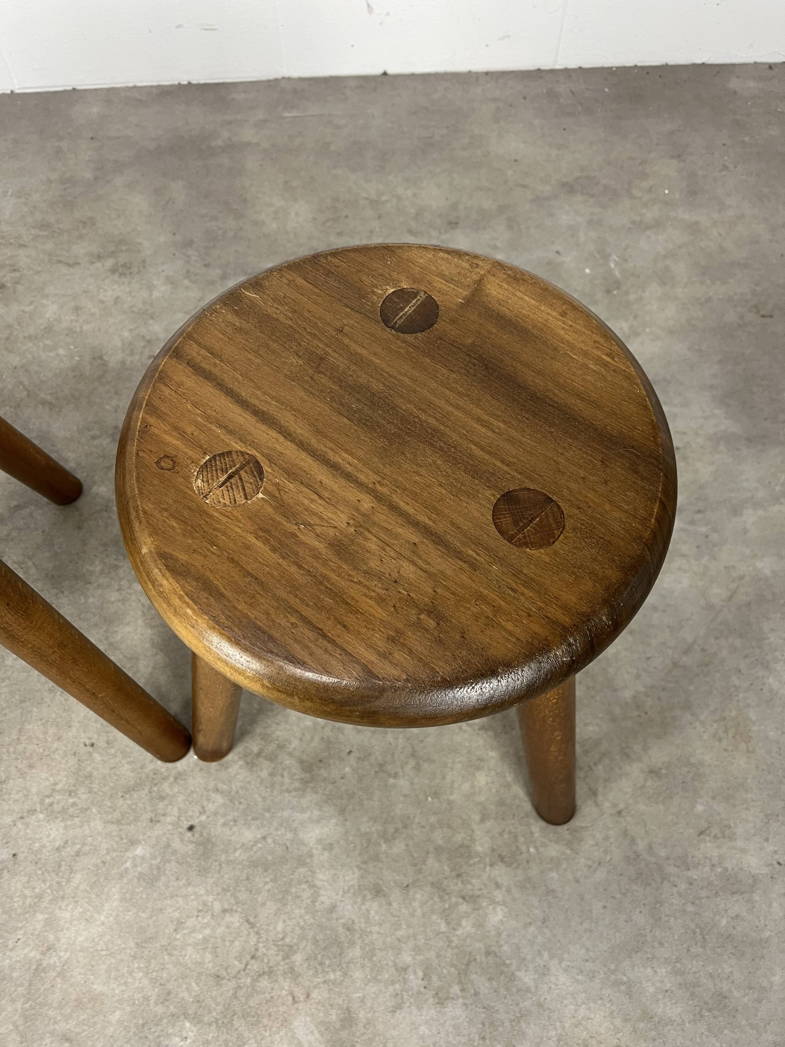 4 wooden tripod stools
