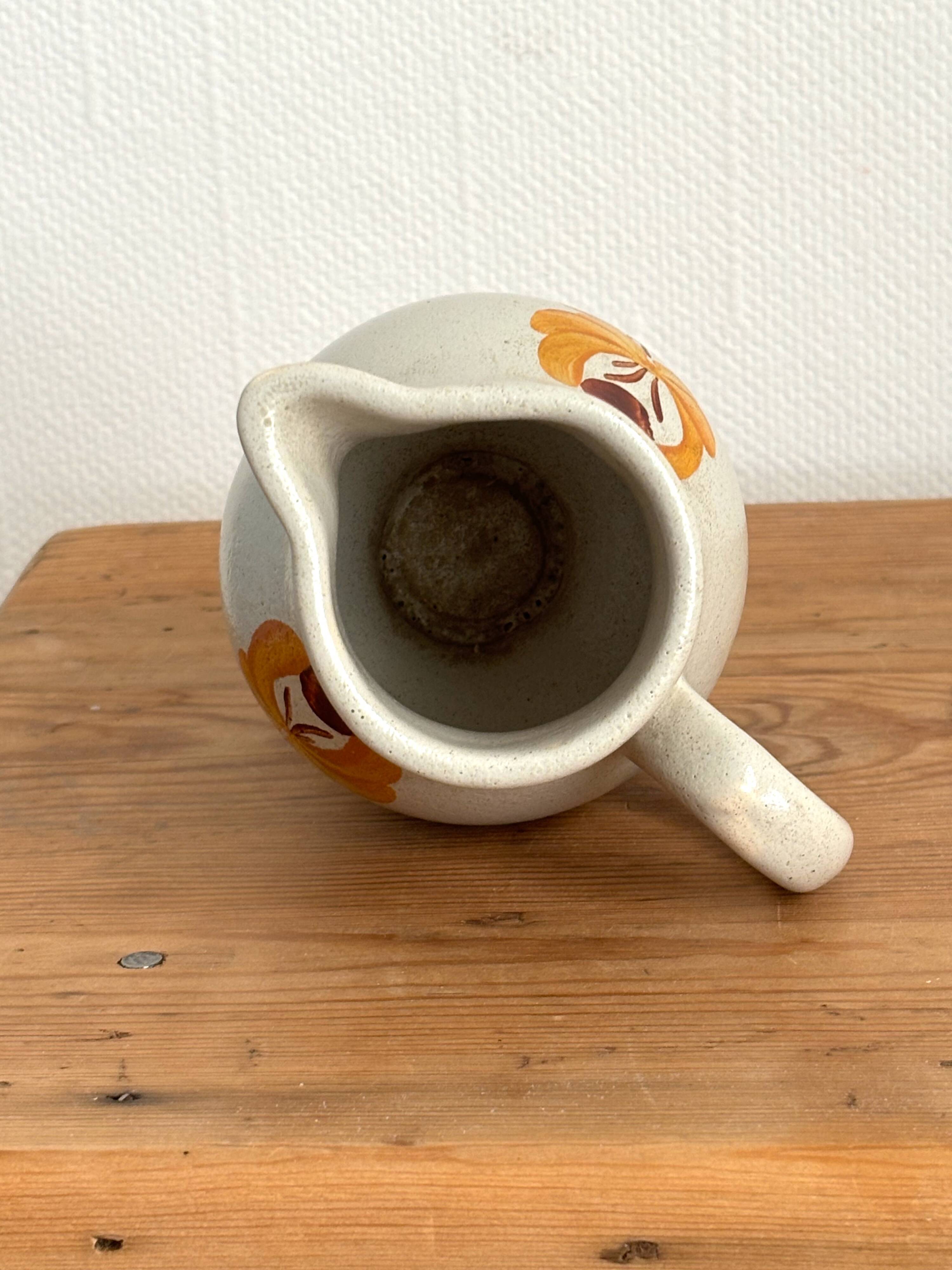 Vintage Maine St Amand earthenware pitcher with floral decorations