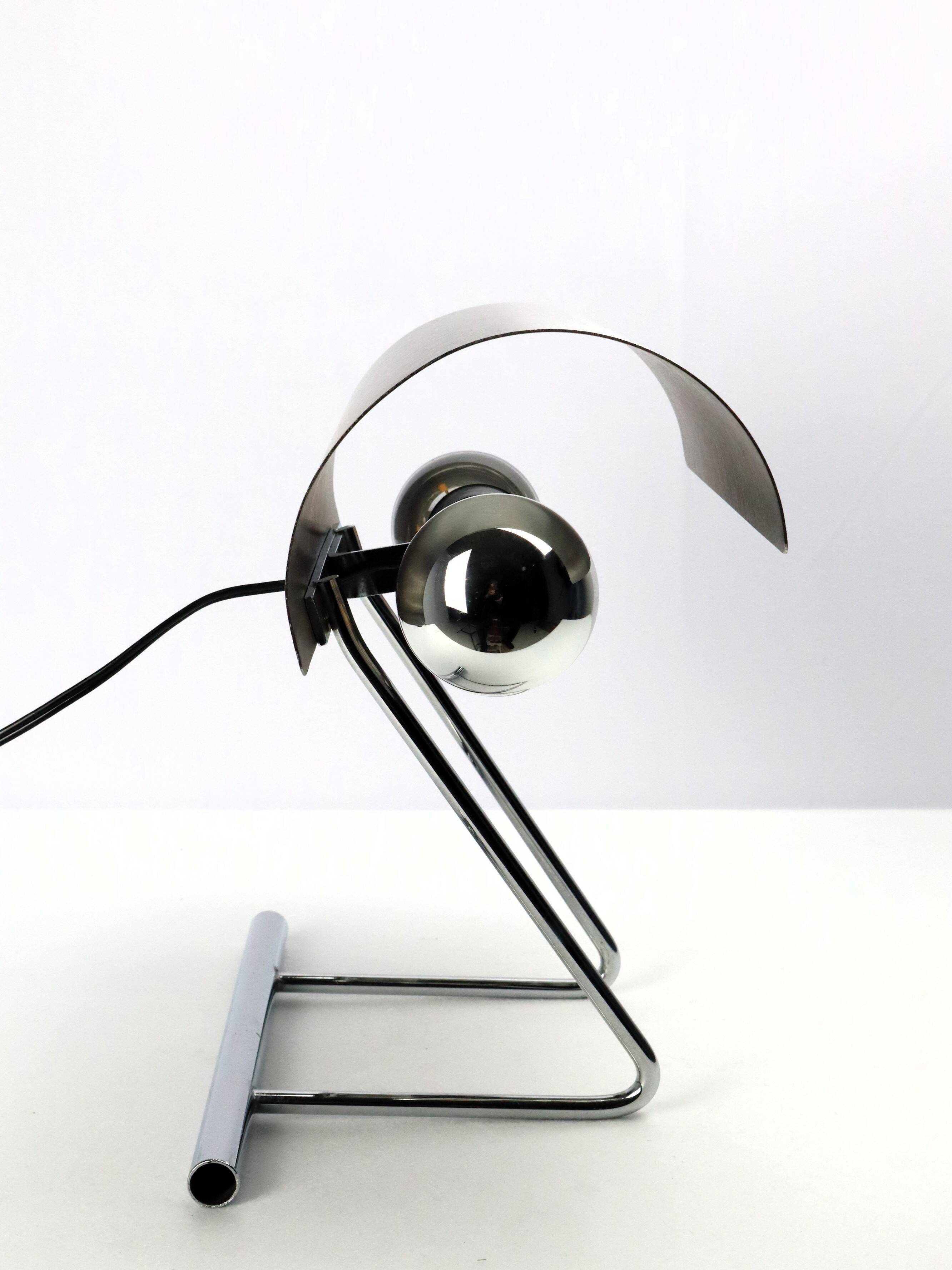 Stainless steel lamp from the 1970s in the style of François Monnet.