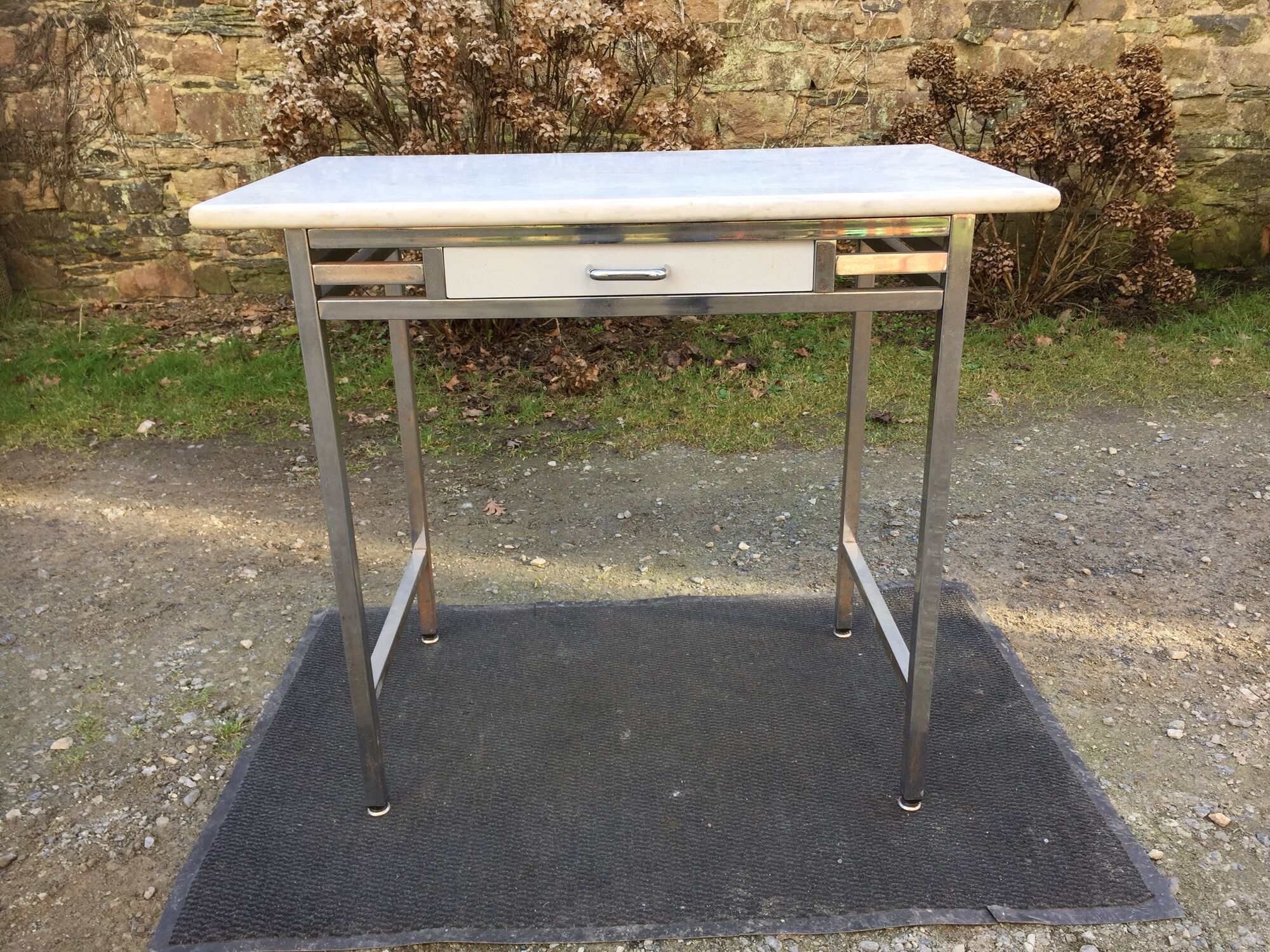 Vintage table with square chrome tubular metal base and marble top with 1 drawer.