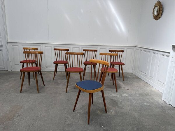 Huit chaises Baumann à assise colorée