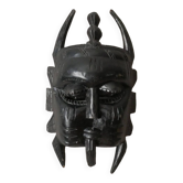 Decorative mask hand carved in tribal ethnic painted wood