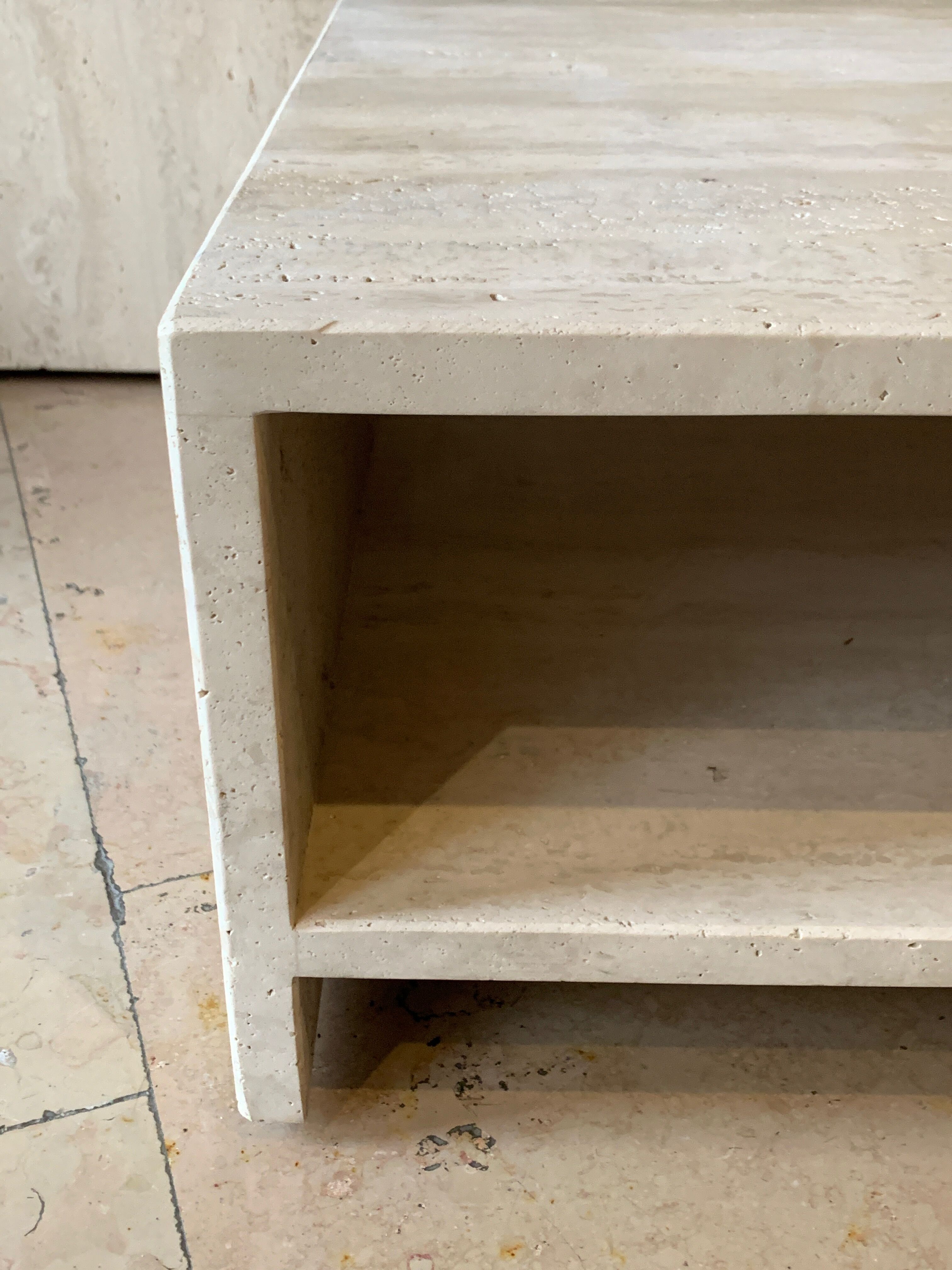 Modular square coffee tables in softened travertine