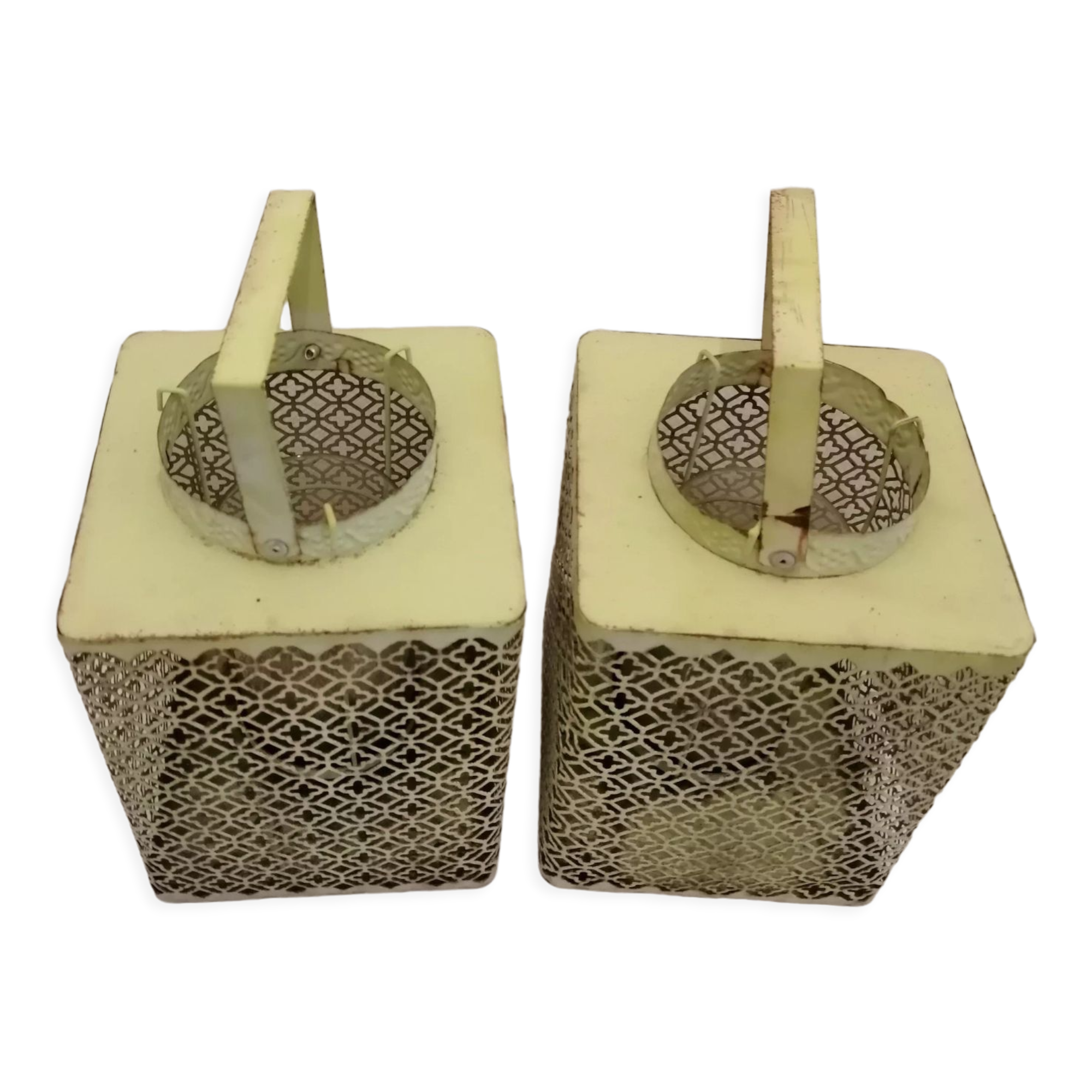 Metal lanterns with garden candles