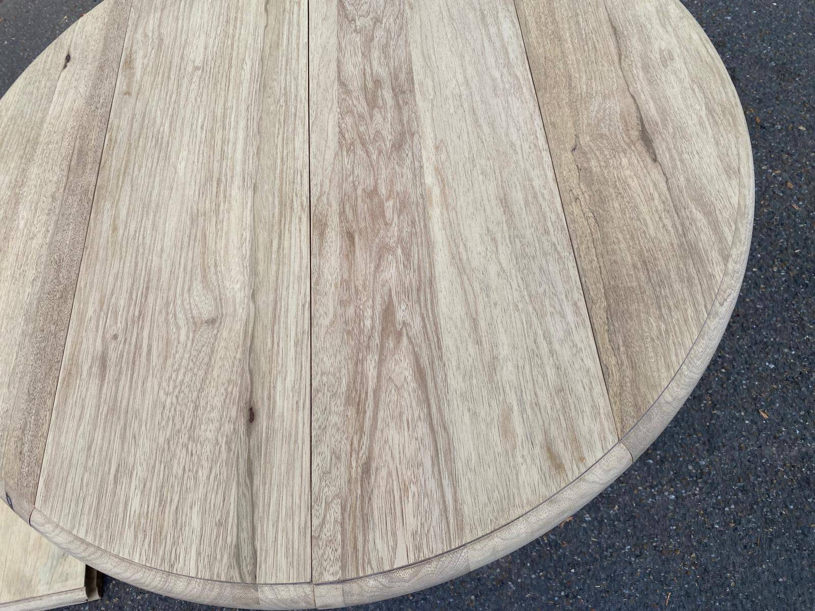 Round extendable dining table with flaps, stripped in raw oak, with 3 extensions.