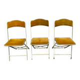 Three folding opera chairs in old gold velvet and brass structure