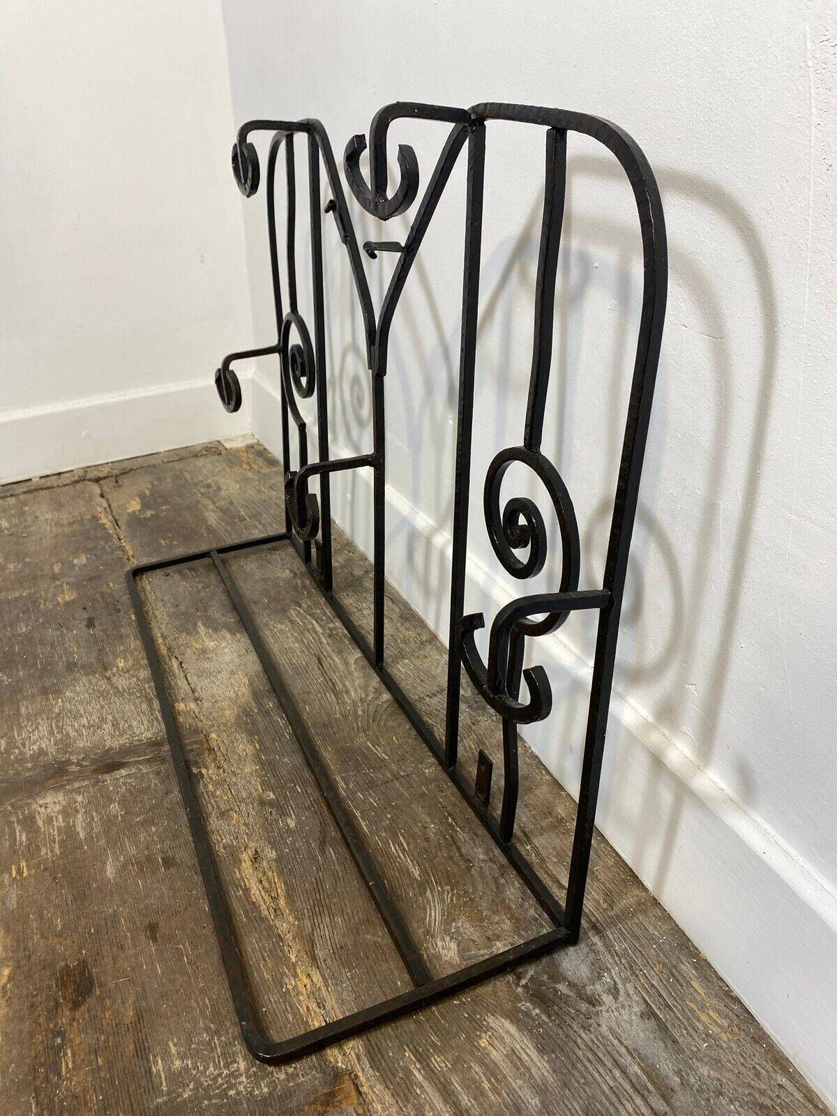 Wall-mounted coat rack in wrought iron, early 20th century