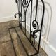 Wall-mounted coat rack in wrought iron, early 20th century